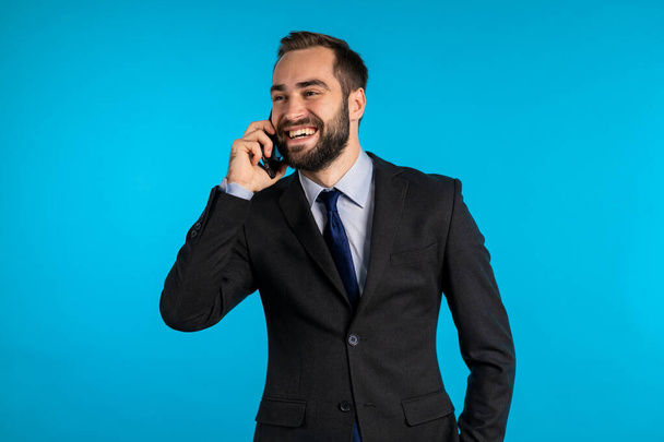 Close up portrait of businessman have conversation using mobile phone. Business guy in formal suit gladly talks with colleague. Office employee, wage worker, weekdays concept - Foto, Imagem