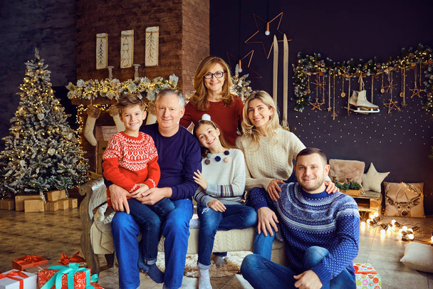 Big family in a room with a fireplace in Christmas. - Photo, Image
