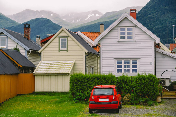 Countryside view of colored wooden buildings. Boathouses in Norway. Scandinavian traditional boat houses. multi-colored garage wooden houses in coastal Norwegian fishing village - Photo, image