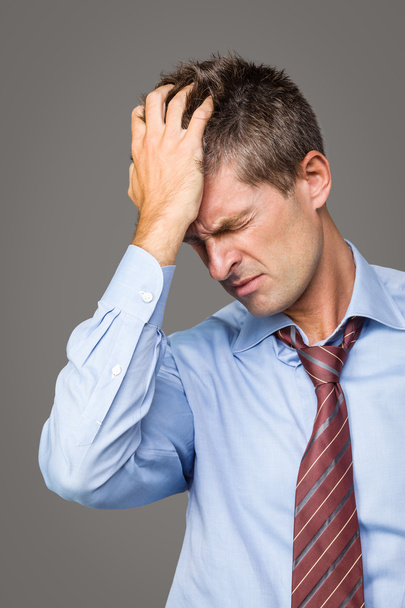 zakenman lijden hoofdpijn - Foto, afbeelding