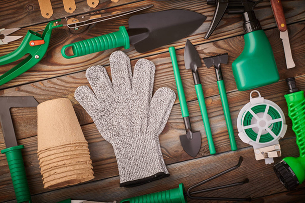 Gardening tools on wooden background flat lay - Foto, immagini