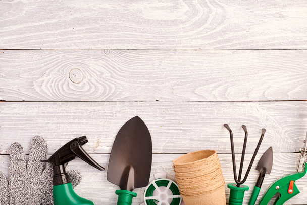 Gardening tools on wooden background flat lay - Photo, Image