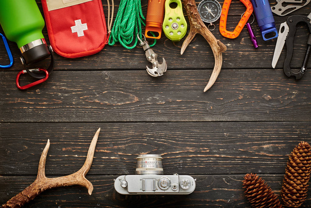 Travel items for hiking over wooden background - Photo, Image