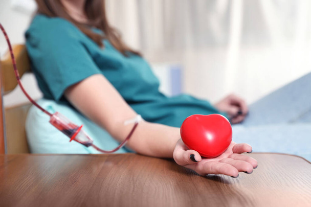Teenager donating blood in hospital, closeup view - Zdjęcie, obraz