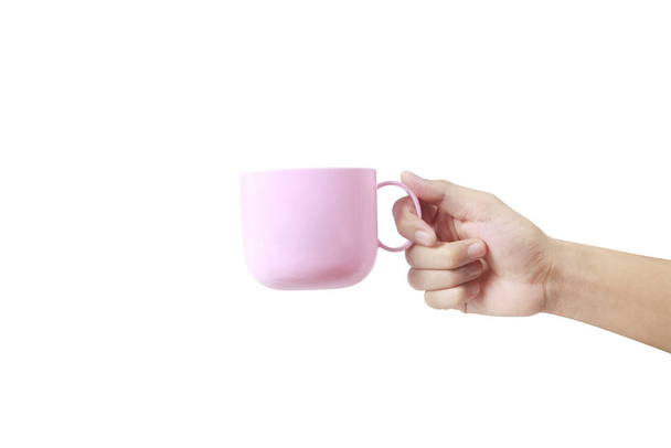 Main tenant une tasse en plastique comme un coulage
 - Photo, image