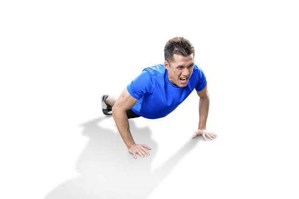 Asian man doing workout push up - Photo, Image