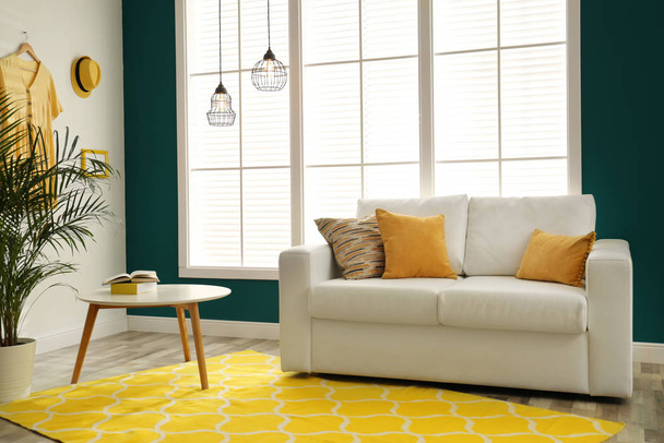 Modern comfortable sofa in stylish home interior - Фото, зображення