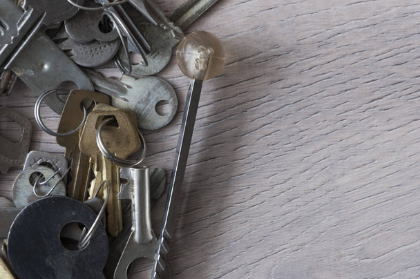 Group of the different vintage keys to a door and furniture - 写真・画像