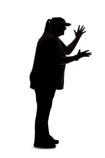 Silhouette of a curvy or plus size woman on a white background.  She is unrecognizable and is wearing casual apparel. She is gesturing as if she is angry - Fotó, kép