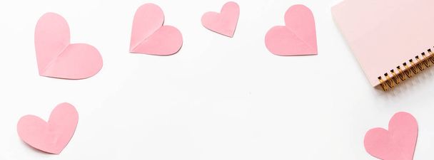 Valentine's day background with pink hearths on white. Flat lay, top view, mockup, template, copy space. Minimal abstract composition for 14 February celebration - Foto, Bild