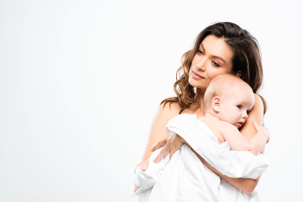 portrait of attractive nude mother holding baby, isolated on white - Fotoğraf, Görsel