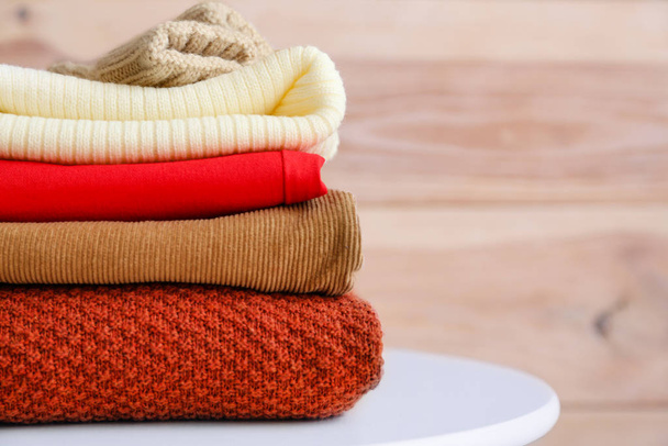 Set of warm winter clothes on table - Photo, Image