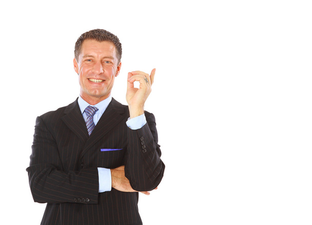Attractive business man pointing at copy space - Foto, Imagem