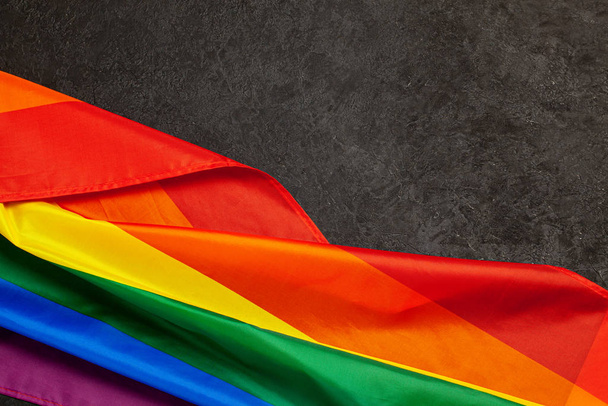LGBT Pride Rainbow Flag. Black background - Zdjęcie, obraz