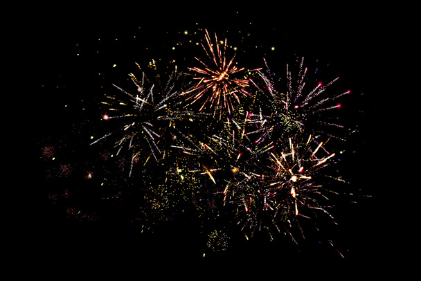traditional festive fireworks in dark night sky, isolated on black - Photo, Image