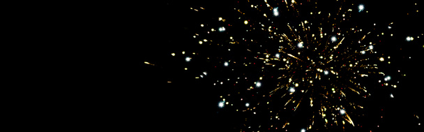 panoramic shot of golden fireworks in night sky, isolated on black - Photo, Image