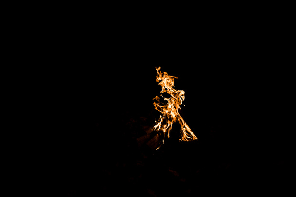 orange flame in bonfire isolated on black - Photo, Image