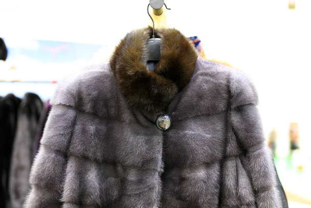 Luxury fur coats hanging on rack, - Photo, Image