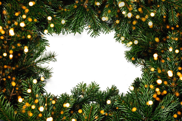 Frame made of Christmas tree braches with lights - Φωτογραφία, εικόνα