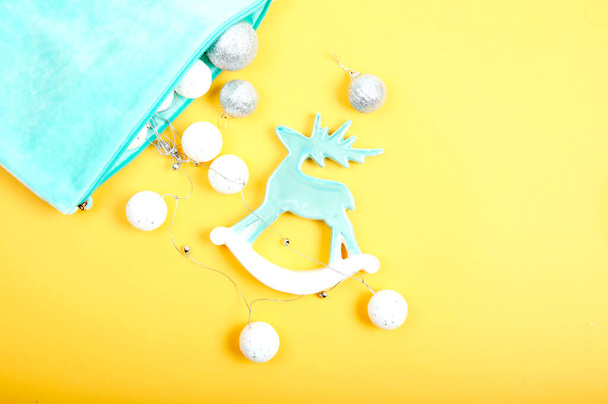 Toy pastel blue deer with Christmas garland - Photo, image