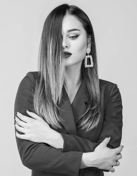 Sexy woman with professional makeup. jewelry earrings. Girl in red jacket. beauty and fashion. hair beauty and hairdresser salon. Fashion portrait of elegant woman. Funky beauty - Φωτογραφία, εικόνα