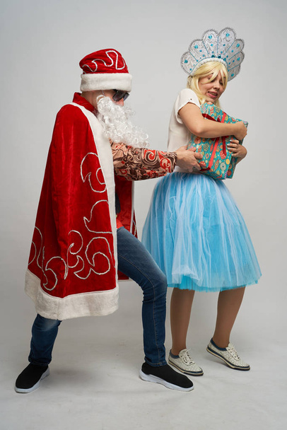 Santa Claus and snow maiden, thanksgiving, Christmas and New year, red yellow blue balls, - Zdjęcie, obraz