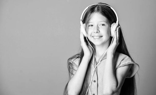 Educative content. Study english language with audio lessons. Girl listen music modern headphones gadget. Perfect sound. Having fun. Listen for free. Enjoy music concept. Music app. Audio book - Foto, Imagen