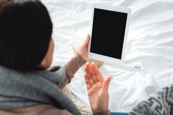 sick girl with flu having online consultation with doctor on digital tablet - Foto, Bild