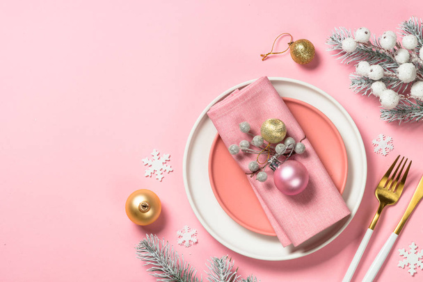 Christmas table setting on pink top view. - Fotó, kép