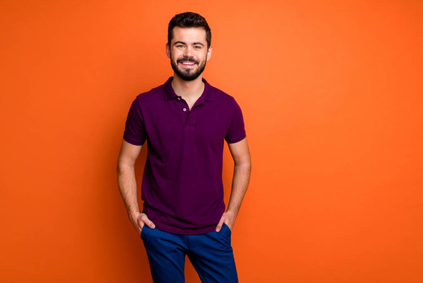 Portrait of cheerful guy have spring weekends put hands pockets wear casual style clothing isolated over vivid color background - Zdjęcie, obraz