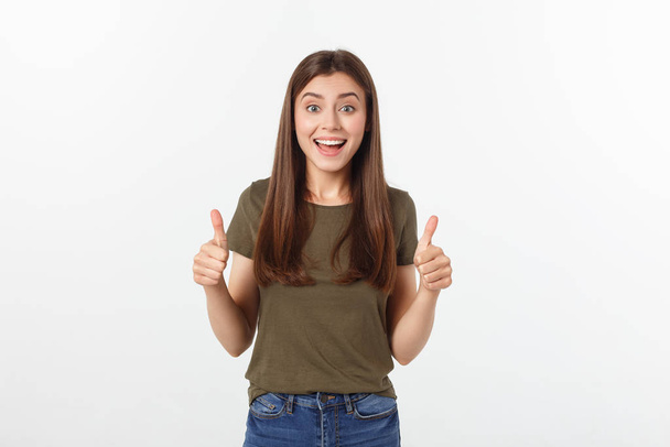 Closeup portrait of a beautiful young woman showing thumbs up sign. Isolate over white background. - Foto, Imagem