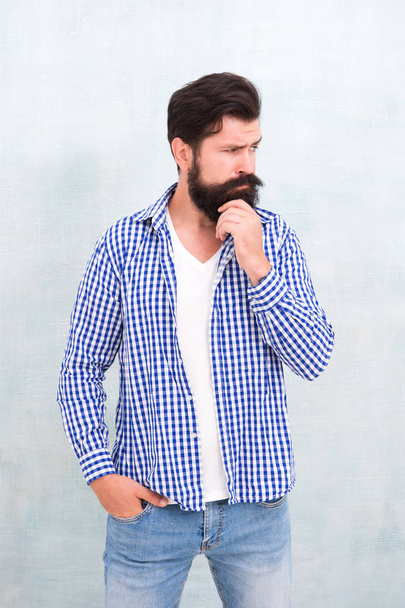 Attractiveness concept. Well groomed guy. Brutal handsome hipster man grey wall background. Bearded man trendy hipster style. Masculinity and male beauty. Hipster with beard and mustache wear shirt - Fotografie, Obrázek