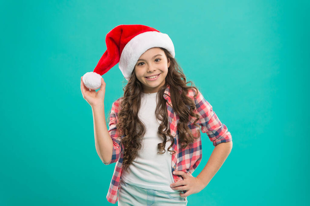 Santa claus kid. Happy winter holidays. Small girl. Play with pompom. Waiting for Santa. Spread joy and love, it is Christmas season. Little girl child in santa hat. Present for xmas. New year party - Photo, Image