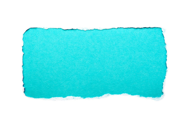 A hole in white paper with torn edges isolated on a white background with a light blue color paper background inside. Good paper texture - Foto, immagini