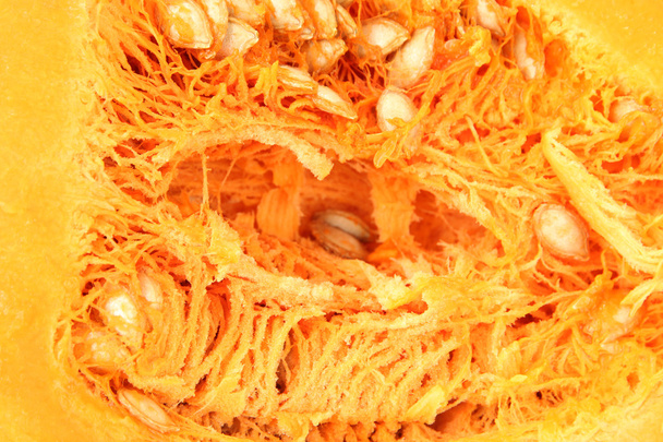 Ripe cut pumpkin close-up background - Фото, изображение