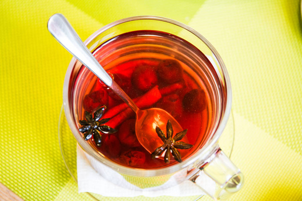 Tea with cherries and cinnamon - Photo, Image