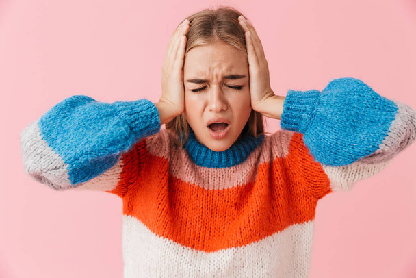 Portrait of an annoyed blonde girl wearing sweater - Foto, Imagem