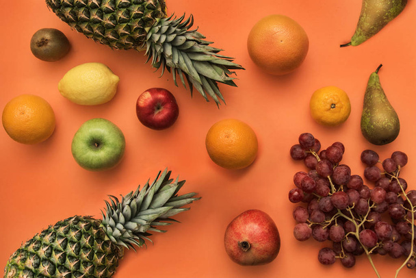 Different fruits on bright color background. - Photo, Image