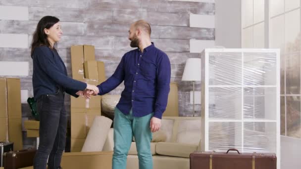 Caucasian couple excited about their new apartment - Felvétel, videó
