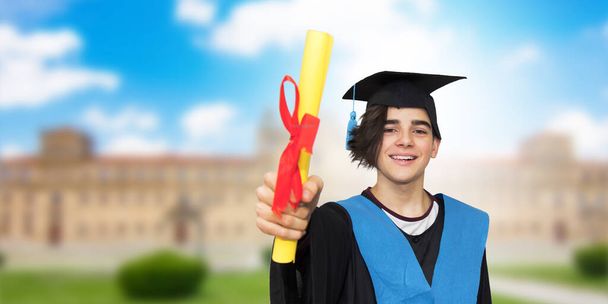 graduation on campus, young student with the degree - Φωτογραφία, εικόνα