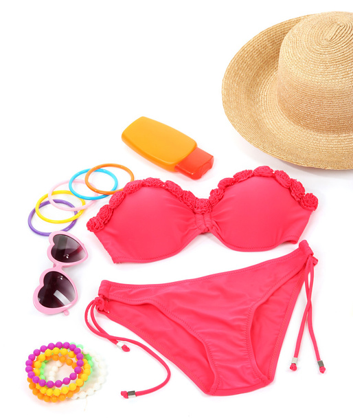 Swimsuit and beach items isolated on white - Foto, afbeelding