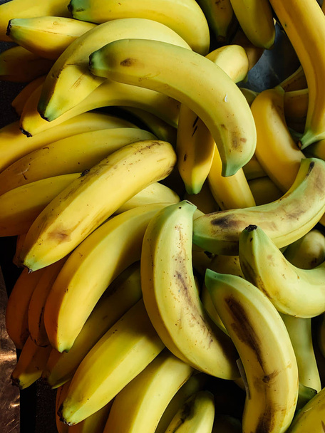 lots of ripe yellow bananas for eating a background - Photo, Image