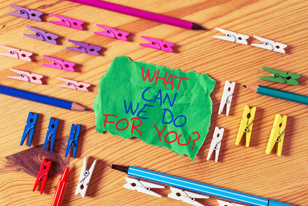 Writing note showing What Can We Do For You Question Question Question. Business photo showcasing how may I help assist Colored clothespin papers empty reminder wooden floor background office. - Photo, Image