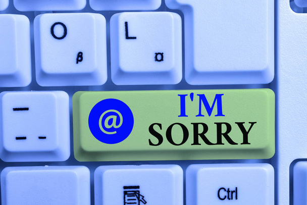 Writing note showing I M Sorry. Business photo showcasing Toask for forgiveness to someone you unintensionaly hurt White pc keyboard with note paper above the white background. - Photo, Image