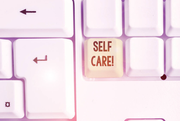 Word writing text Self Care. Business concept for practice of taking action to preserve or improve ones own health White pc keyboard with empty note paper above white background key copy space. - Photo, Image