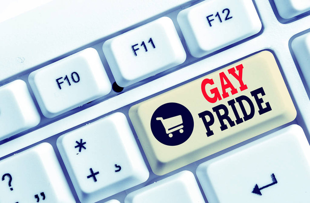 Text sign showing Gay Pride. Conceptual photo Dignity of an idividual that belongs to either a analysis or woanalysis White pc keyboard with empty note paper above white background key copy space. - Photo, Image
