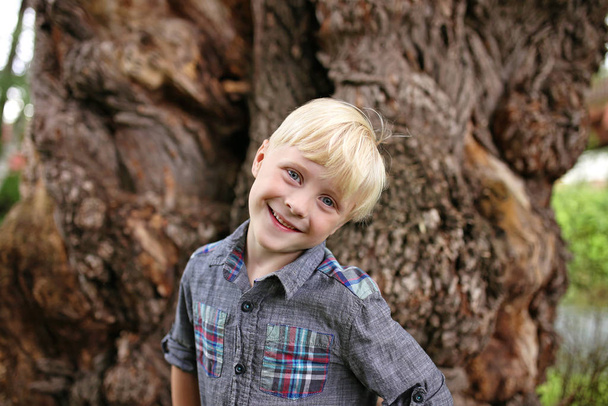 Cute Blonde Hair Blue Eyed Boy Child Outside Smiling in Nature - Фото, изображение