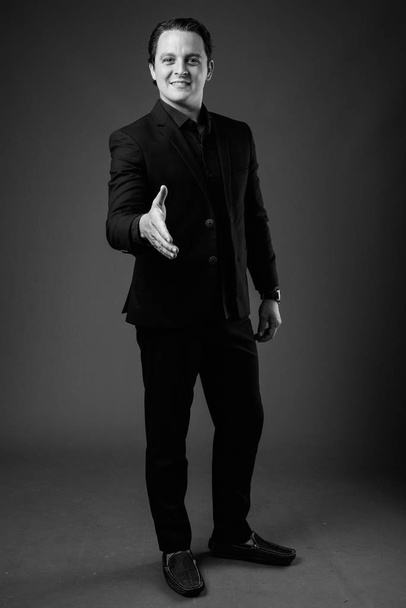 Studio shot of Italian businessman in black and white - Фото, зображення