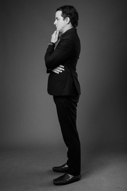 Studio shot of Italian businessman in black and white - Фото, изображение
