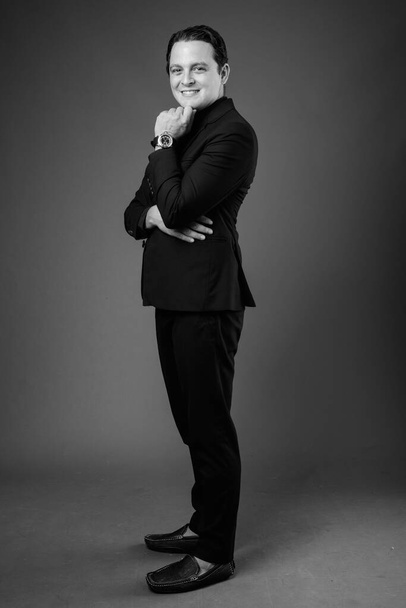 Studio shot of Italian businessman in black and white - Foto, imagen